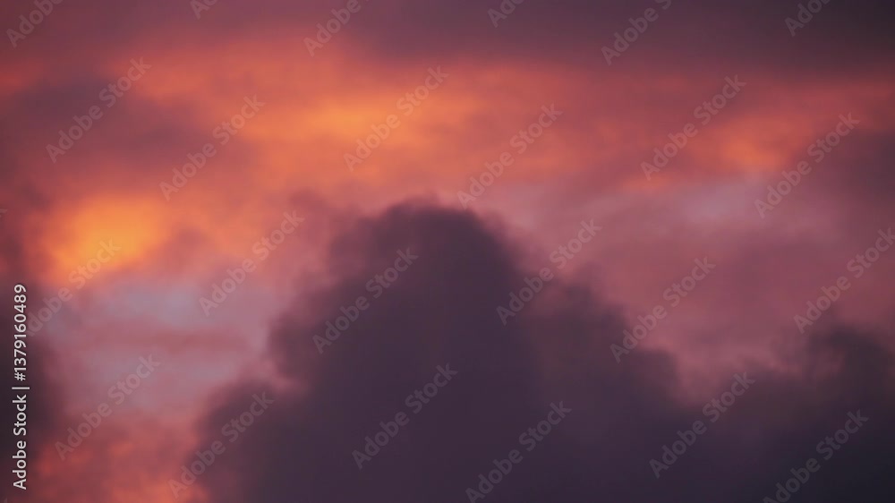 Time lapse of dark clouds passing by at sunset Time lapse of dark clouds passing by at sunset