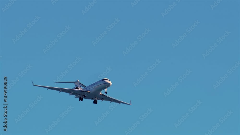 Nice, France - March 17, 2025: Airplane flying on the blue sky in daylight Nice, France - March 17, 2025: Airplane flying on the blue sky in daylight
