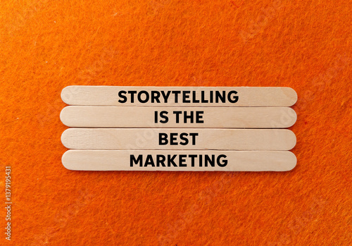 Storytelling is the best marketing message written on wooden sticks on orange background. Conceptual storytelling is the best marketing symbol. Copy space.