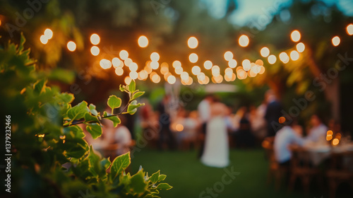 Outdoor wedding reception at night in garden setting illuminated by string lights, with blurred people in background celebrating romantic and joyful event in warm, cozy, and intimate evening ambiance.