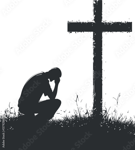 Silhouette of a person kneeling in prayer beside a cross in a grassy field.
