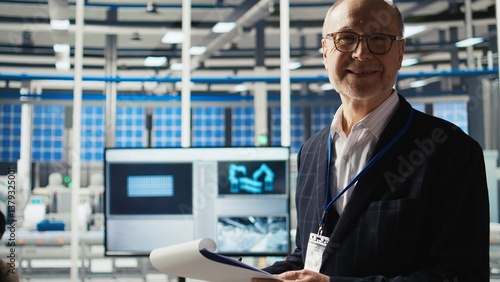 Canvas Print Portrait of smiling industrial plant shareholder conducts research on potential investment opportunities