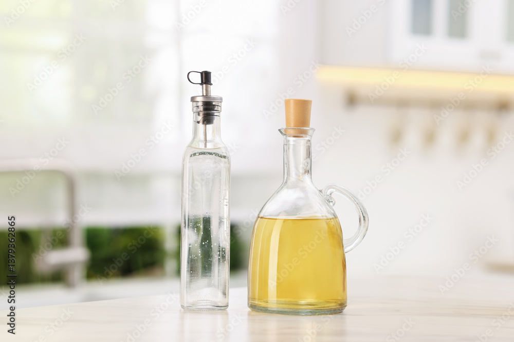 Salad dressings in bottles on table indoors Salad dressings in bottles on table indoors