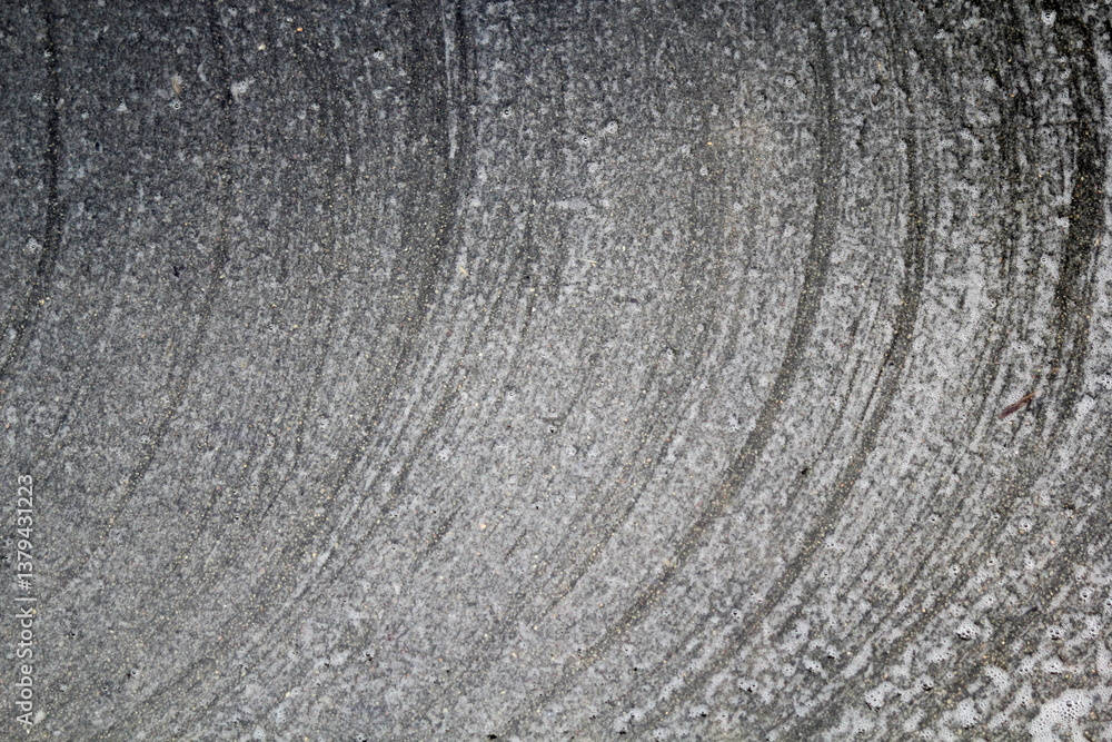 Fototapeta premium Concrete with curved lines close-up abstract textured background