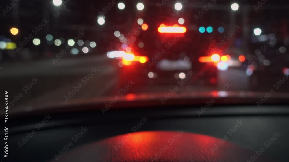 View from a moving car of a car's blinker indicating the direction change at night View from a moving car of a car's blinker indicating the direction change at night