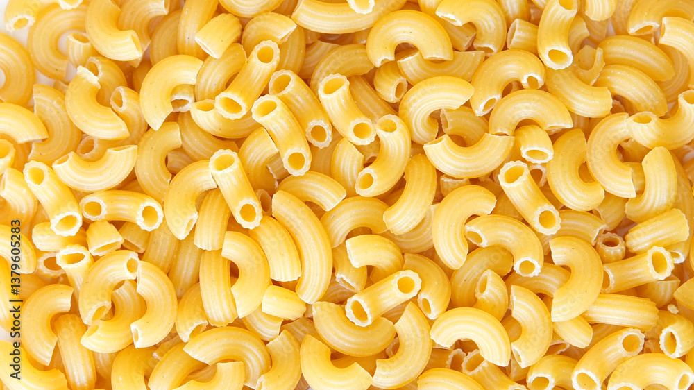 close-up view of dry elbow macaroni pasta, showcasing its curved tubular shape and golden-yellow color. close-up view of dry elbow macaroni pasta, showcasing its curved tubular shape and golden-yellow color.