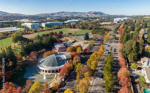 Aerial view of Ramon Community Center, San Ramon, California, USA, during autumn. The image shows the city's landscape, including office buildings, parks, and tree-lined streets with fall foliage.