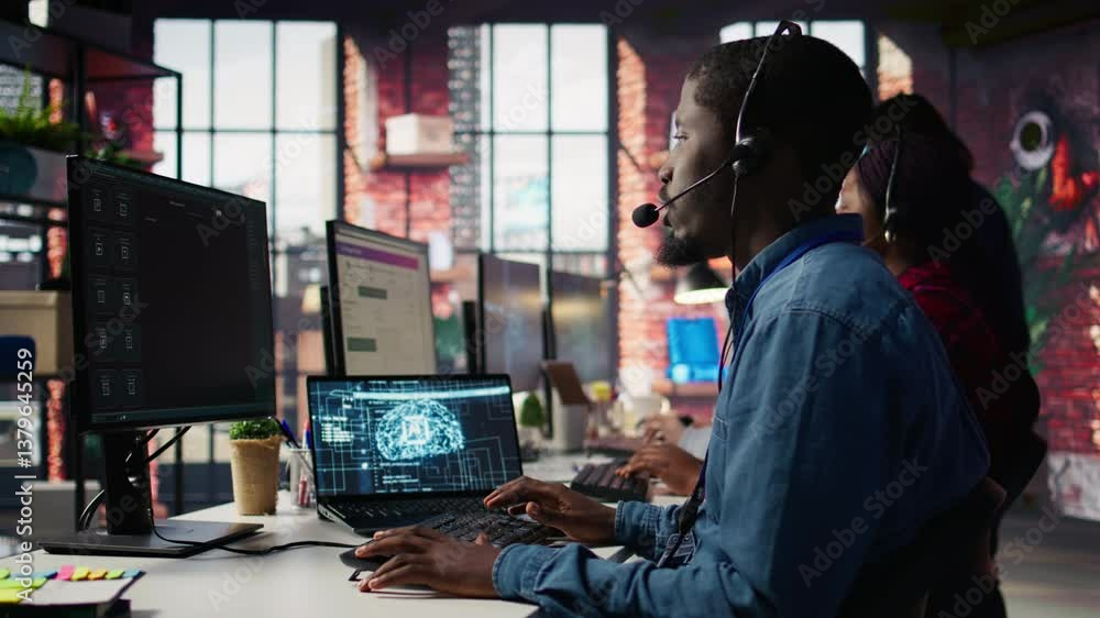 Call center worker in office using AI chatbot to answer customer questions. Man doing customer service job using artificial intelligence, generating automated responses providing solutions, camera B Call center worker in office using AI chatbot to answer customer questions. Man doing customer service job using artificial intelligence, generating automated responses providing solutions, camera B