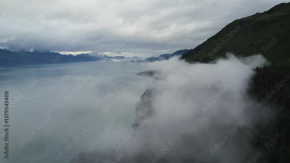 Slow-Motion Drone Pitch Forward, Flying Through Dense Smog Below and Towering Clouds Above Mountain Peaks Slow-Motion Drone Pitch Forward, Flying Through Dense Smog Below and Towering Clouds Above Mountain Peaks
