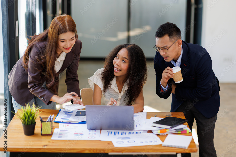 Group of confident business people point to graphs and charts to analyze market data, balance sheet, account, net profit to plan new sales strategies to increase production capacity.
Group of confident business people point to graphs and charts to analyze market data, balance sheet, account, net profit to plan new sales strategies to increase production capacity.