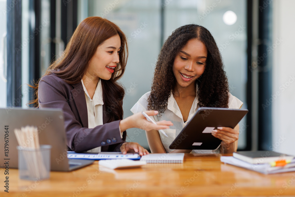 Two business women or an accountant team are analyzing data charts, graphs, and a dashboard on a laptop screen in order to prepare a statistical report and discuss financial data in an office
Two business women or an accountant team are analyzing data charts, graphs, and a dashboard on a laptop screen in order to prepare a statistical report and discuss financial data in an office