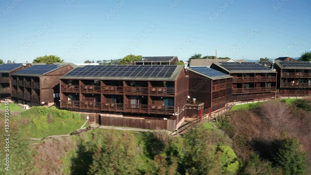 Aerial close-up dolly shot of a lodge above the cliff overlooking the Noyo River in Fort Bragg, California. 4K