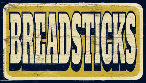 Aged and worn breadsticks sign on wood