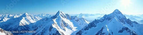 Aerial view of snow-covered mountains under clear blue skies with sunlight glistening on the peaks,  sunlight,  glistening