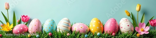 Beautiful Easter background with colorful painted eggs and blooming spring flowers,  decoration,  vibrant