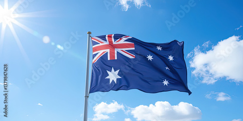 Australian national flag waving in the wind against a blue sky – Symbol of patriotism for Australian Independence Day, Republic Day, and national celebrations.