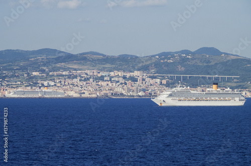 Obraz na płótnie Mega family cruiseship cruise ship liner Fortuna anchored offshore of Civitavecchia Rome, Italy before reactived after Covid pandemic with other vessels in port and coastline w salonie