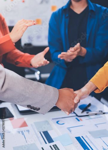 Business handshake for teamwork of business merger and acquisition,successful negotiate,hand shake,two businessman shake hand with partner to celebration partnership and business deal concept