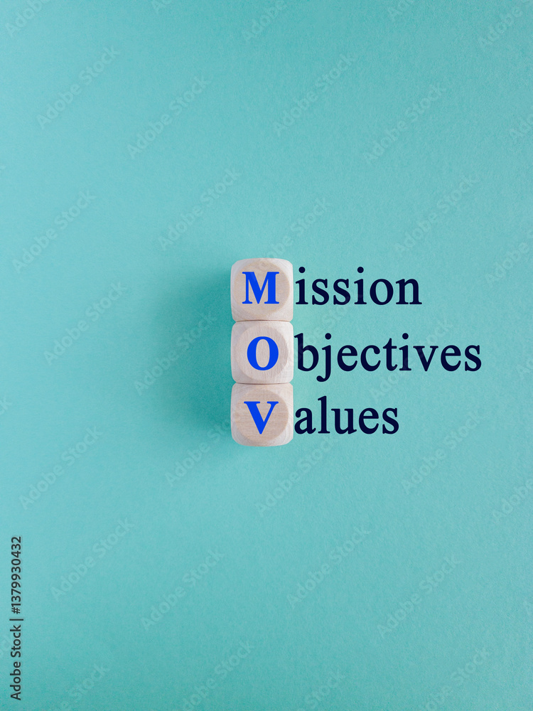 Mission objectives values symbol. On the wooden cubes concept words Mission Objectives Values. Beautiful blue background. Business mission objectives values concept.