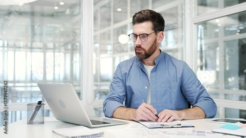 Wallpaper Mural Busy businessman doing paperwork using laptop sitting at desk at workplace in business office. Confident financier working fills out documents, writing, making a tax return or engaged in accounting Torontodigital.ca