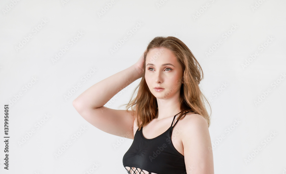 Portrait of a woman in a T-shirt on a light background. Portrait of a woman in a T-shirt on a light background.