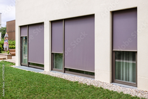 Blinds Outdoor. Modern Textile Roller Shutters on Large Windows. Screen Fabric Solar Blinds Outdoor. 