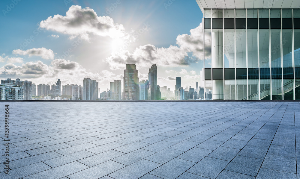 Empty square floor and city skyline with modern buildings under a sunny sky