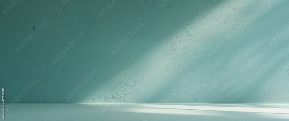 Teal textured wall background studio shot.