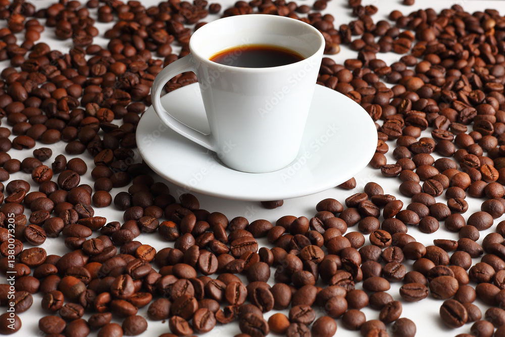 Fototapeta premium Steaming Coffee Next to Roasted Beans on a Pure White Surface