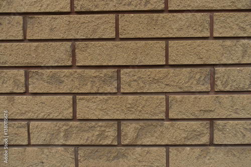 Obraz na płótnie Close shot of beige split face brick veneer wall with running bond layout w salonie
