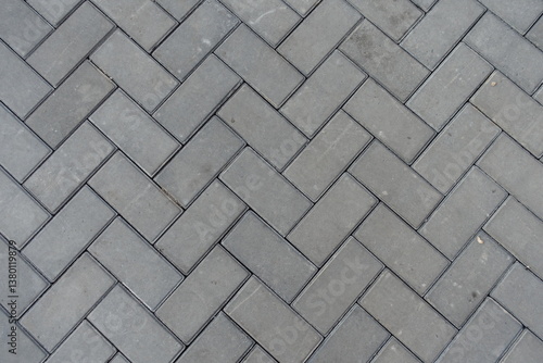 Obraz na płótnie Background - grey concrete pavement with single herringbone layout w salonie