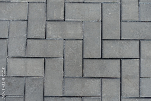 Obraz na płótnie Close shot of grey concrete pavement with single herringbone layout w salonie