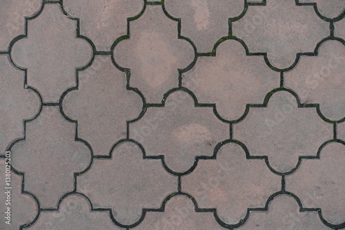 Obraz na płótnie Close shot of pale pink pavement of interlocking concrete tiles with moroccan lattice layout w salonie