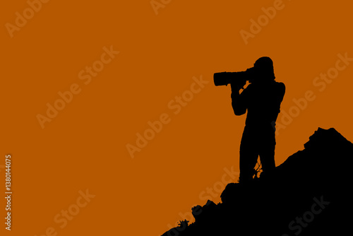 Silhouette photo style of Photographer stand on the top peak of mountain.