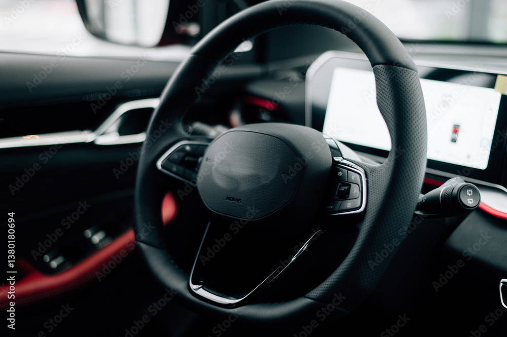 steering wheel and control buttons in an expensive new car steering wheel and control buttons in an expensive new car