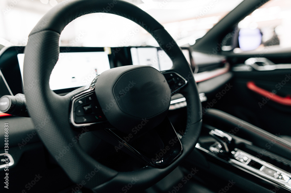 steering wheel and control buttons in an expensive new car steering wheel and control buttons in an expensive new car