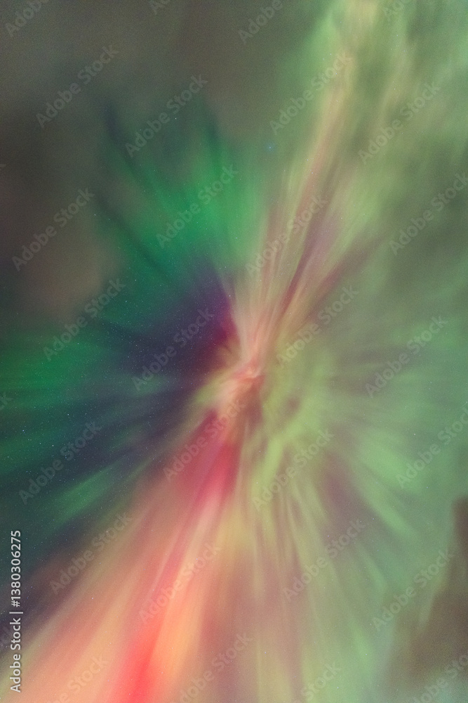 The Northern Lights dance over the Isle of Skye, painting the night sky in vibrant greens and purples. A magical display above Scotland’s rugged landscapes.