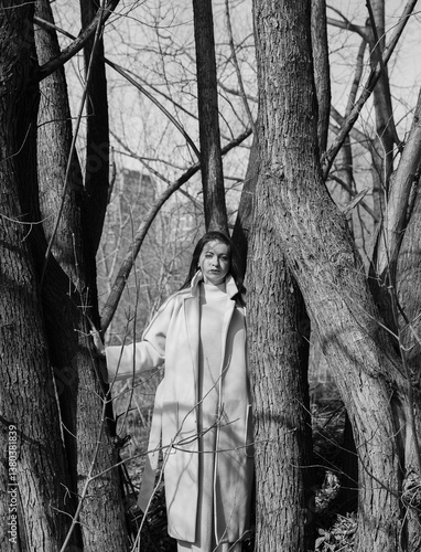 A young woman among the trees