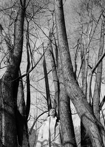 A young woman among the trees