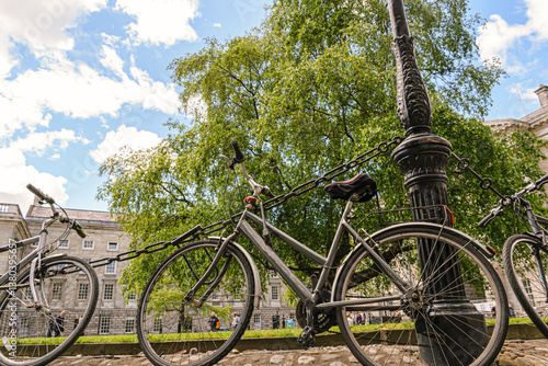Photography Trinity College Dublin with Parked Bicycle on Cobblestone Path
