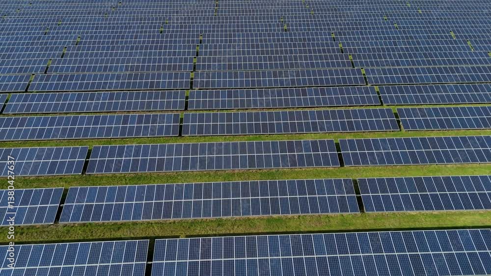 Aerial view drone Large solar panel farm green energy generation England Sunny day Spring renewable energy fossil fuels power plant Aerial view drone Large solar panel farm green energy generation England Sunny day Spring renewable energy fossil fuels power plant