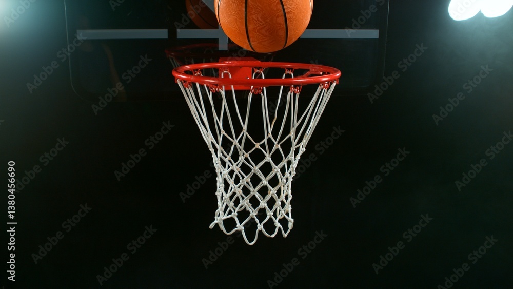 Freeze motion of basketball ball hitting the basket Freeze motion of basketball ball hitting the basket
