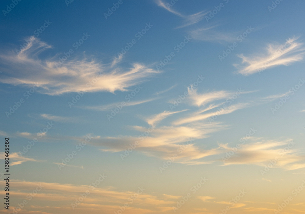 Clouds in Blue Sky at Sunset with Cirrus Clouds and Cloudy Sky. Beautiful cloudscape with soft cirrus clouds in a blue sky at sunset Clouds in Blue Sky at Sunset with Cirrus Clouds and Cloudy Sky. Beautiful cloudscape with soft cirrus clouds in a blue sky at sunset