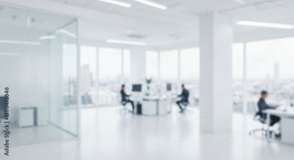 Blurred view of people working in a bright modern office with large windows and white interiors Blurred view of people working in a bright modern office with large windows and white interiors