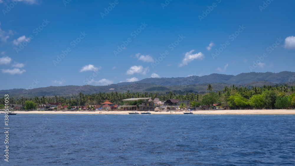 Enjoy a stunning beach view along a beautiful coastline, surrounded by lush foliage and a clear blue sky, perfect for relaxation and outdoor adventures, Nusa Penida, Bali, Indonesia