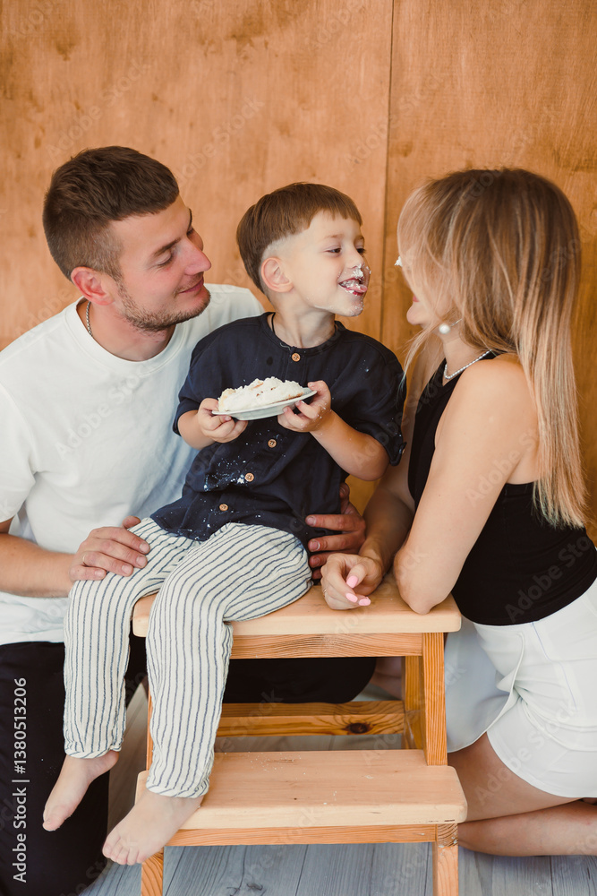 A Joyful Family Moment This delightful scene showcases the playful interaction between loving parents and their enthusiastic child, beautifully captured in a cozy home setting that radiates warmth