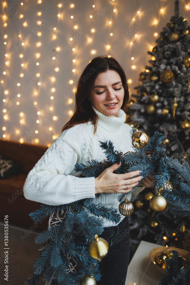 Cute girl in New Year's locations in a cozy living room. Woman at home for the new year.