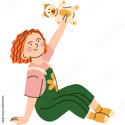 Girl playing with teddy bear. Little girl with curly red hair holding up a teddy bear while sitting on the floor, enjoying playtime.  