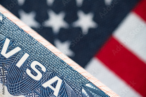 VISA to the USA and the flag of the United States of America. work and travel documents for visiting the USA. Visa for immigration
