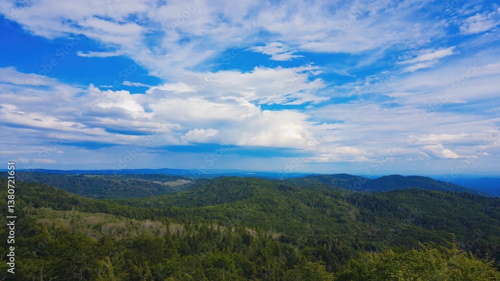 Panoramic view of mountains from a hill, ideal for use in travel or nature-themed projects Panoramic view of mountains from a hill, ideal for use in travel or nature-themed projects